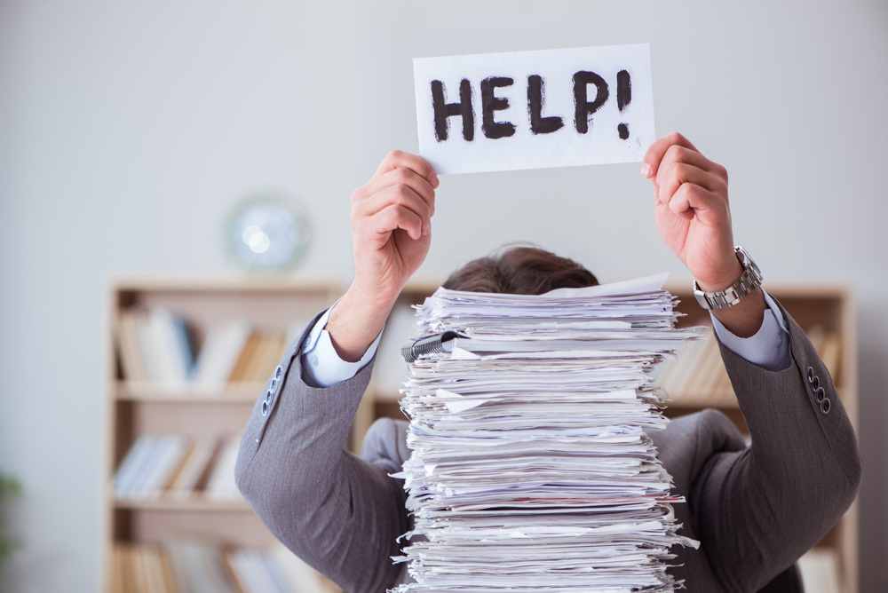 Businessman,Busy,With,Paperwork,In,Office Loan documentation