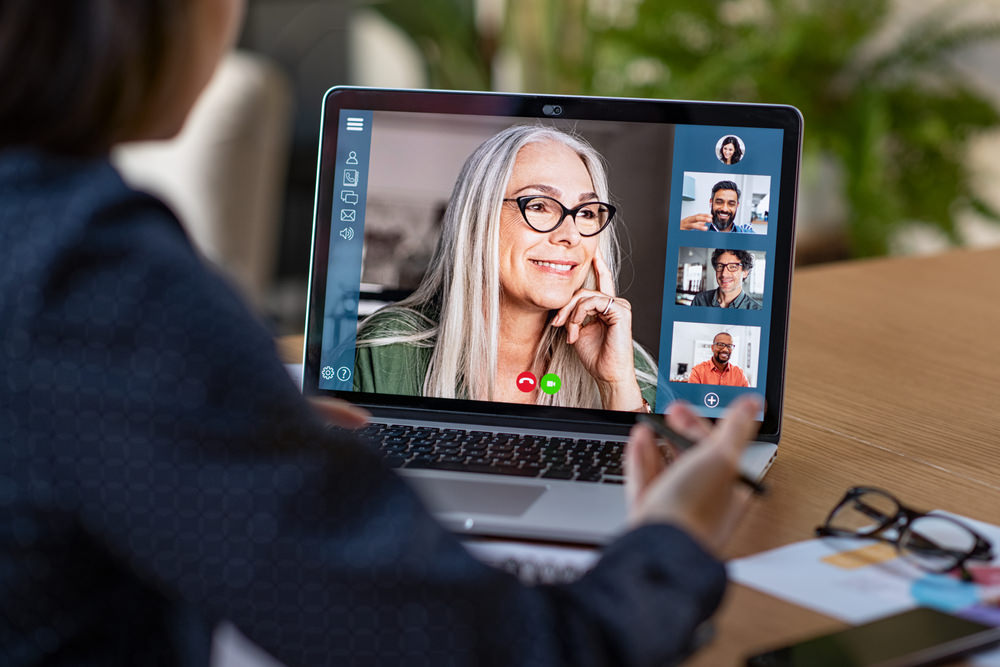 Multiethnic,Business,Team,Having,Discussion,In,Video,Call.,Rear,View Get In Touch